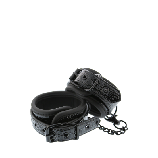 Um par de punhos de tornozelo elegantes feitos de material couro com um design elegante e preto croco brilhante. Eles têm todo o hardware preto livre de níquel e são revestidos em um material de neoprene macio e durável