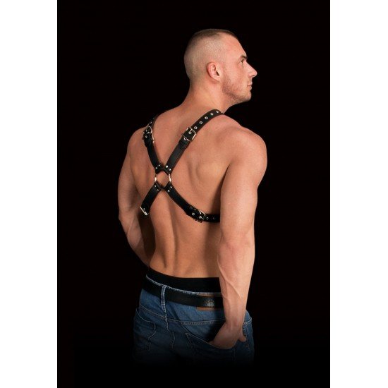 Arnês de Torso Bondage Adonis Pele Preto Adicione ainda mais intensidade às suas aventuras sexuais e permita-se desfrutar do melhor da vida!Arnês masculino fetichista todo em pele decorado com anéis de metal. Com detalhes apaixonantes e super confortável de se