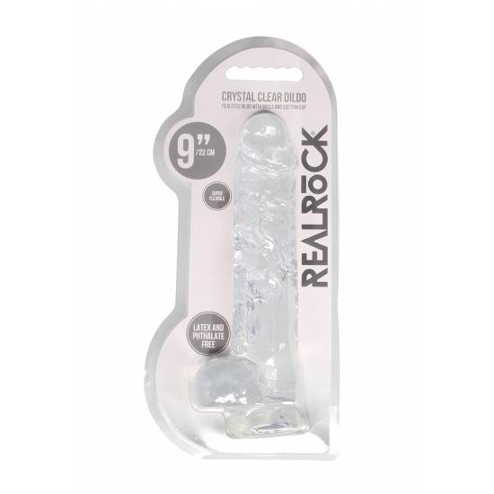 DILDO REALISTICO COM TESTICULOS 23CM TRANSPARENTE - REALROCK Este modelo REALROCK CRYSTAL CLEAR foi projetado com bolas realistas para uma experiência realística aprimorada. Todos vêm com uma ventosa resistente para que você possa colá-los em praticamente qualquer superfície lisa.